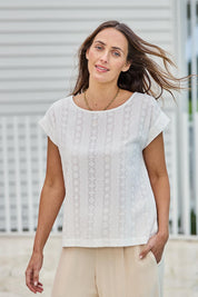 Model Tegand wearing size 10 of the Morning Light Cotton Top – White in colour White, in a cropped view