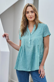 Model Tegand wearing size 10 of the Pleated Delight Cotton Blouse – Mint in colour Mint, from an angle