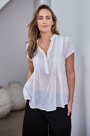 Model Tegand wearing size 10 of the Pleated Delight Cotton Blouse – White in colour White, in a cropped view