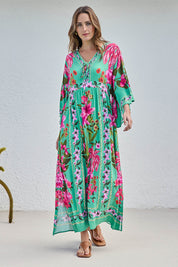 Model Tegand wearing size 10 of the Wild Meadow Maxi Dress - Greenfleur in colour Greenfleur, from the front