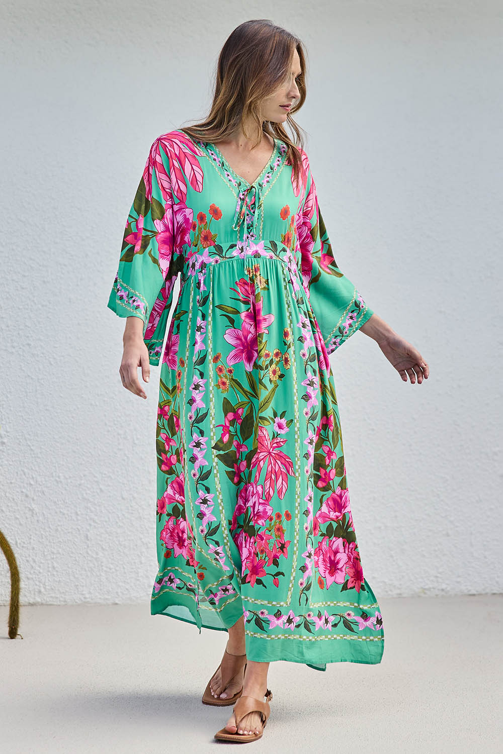 Model Tegand wearing size 10 of the Wild Meadow Maxi Dress - Greenfleur in colour Greenfleur, from the front
