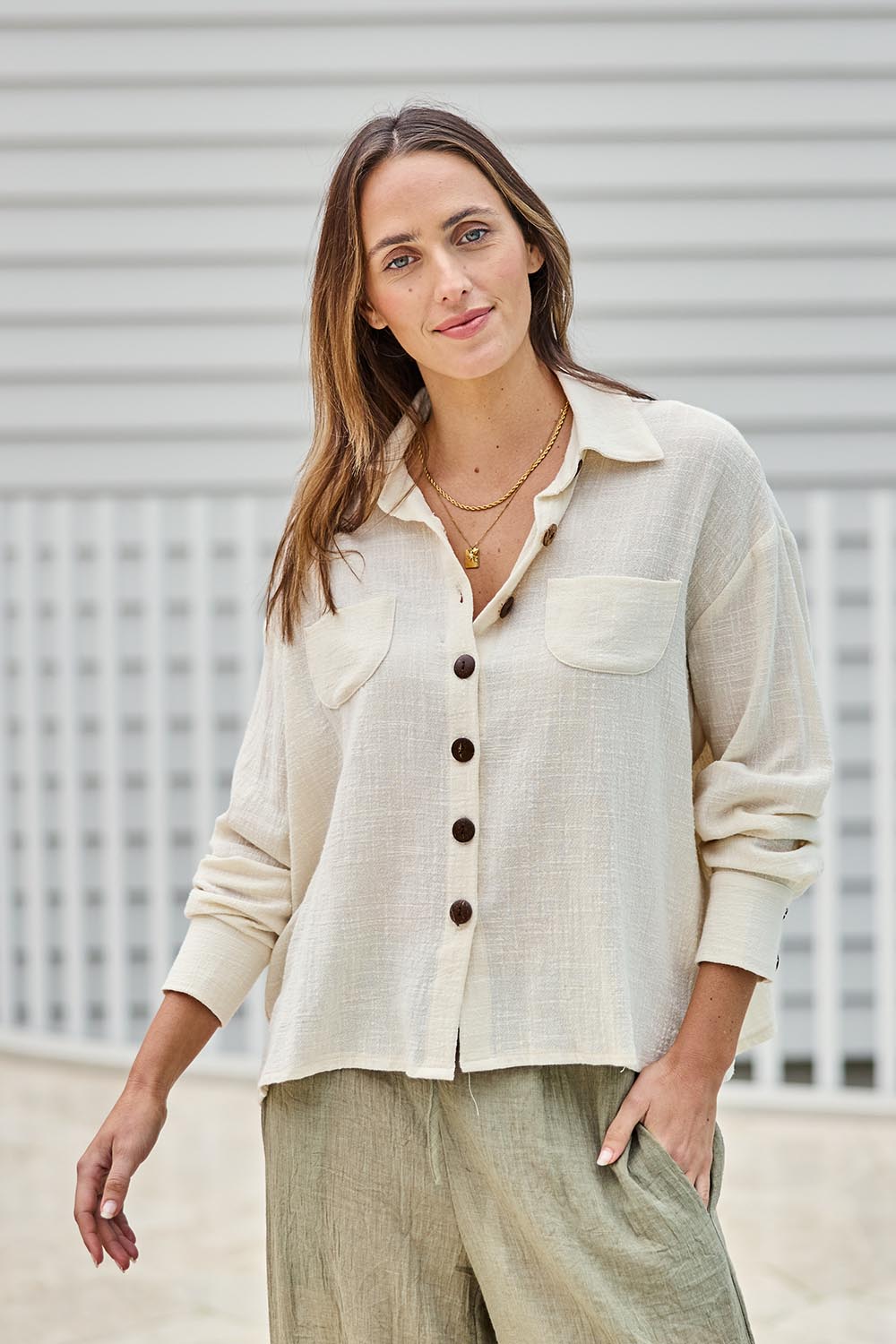 Model Tegand wearing size 10 of the Cute As A Button Cotton Shirt - Birch in colour Birch, in a cropped view