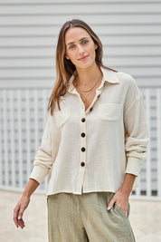 Model Tegand wearing size 10 of the Cute As A Button Cotton Shirt - Birch in colour Birch, in a cropped view