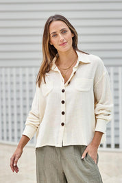 Model Tegand wearing size 10 of the Cute As A Button Cotton Shirt - Birch in colour Birch, in a cropped view