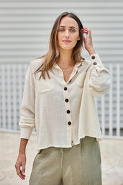 Model Tegand wearing size 10 of the Cute As A Button Cotton Shirt - Birch in colour Birch, in a cropped view