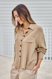 Model Tegand wearing size 10 of the Cute As A Button Cotton Shirt - Rock in colour Rock, from an angle
