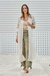 Model Tegand wearing size 10 of the Floating Through The Day Maxi Shirt - Sand in colour Sand, from the front