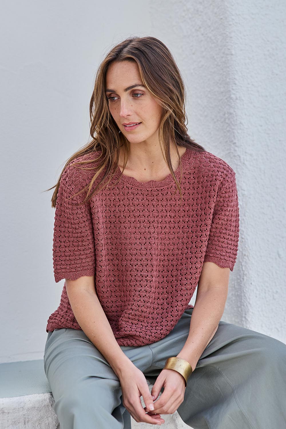 Model Tegand wearing size 10 of the Sunset Stroll Knit Top - Rosewood in colour Rosewood, in a cropped view