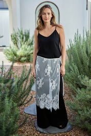 Model Tegand wearing size 10 of the Last Dance Lace Overlay Skirt - White in colour White, from the front