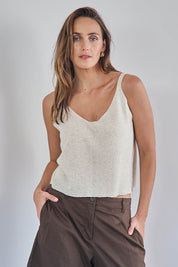 Model Tegand wearing size 10 of the Golden Hour Knit Top And Poncho Set - Natural in colour Natural, in a cropped view