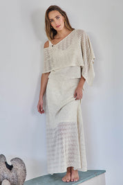 Model Tegand wearing size 10 of the Golden Hour Knit Top And Poncho Set - Natural in colour Natural, from the front