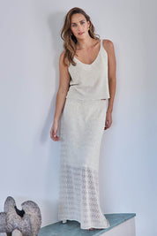 Model Tegand wearing size 10 of the Golden Hour Knit Skirt - Natural in colour Natural, from the front