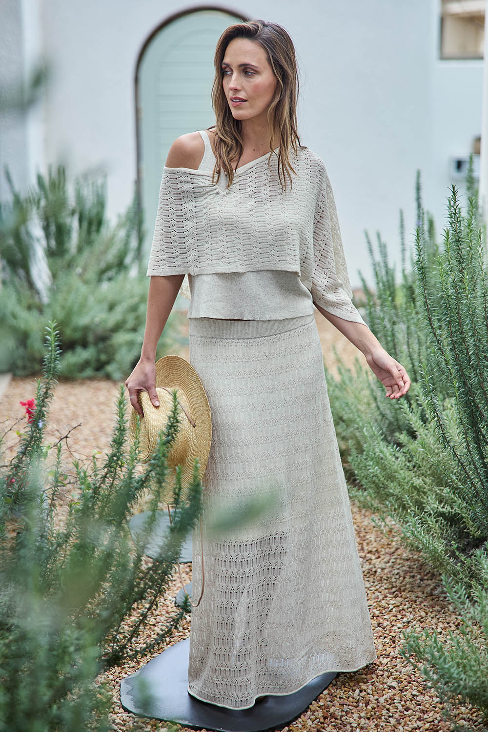 Model Tegand wearing size 10 of the Golden Hour Knit Skirt - Natural in colour Natural, from the front