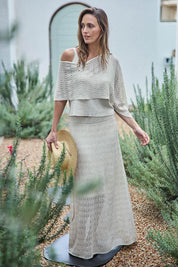 Model Tegand wearing size 10 of the Golden Hour Knit Skirt - Natural in colour Natural, from the front