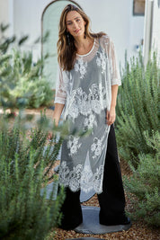 Model Tegand wearing size 10 of the Last Dance Lace Throw Top - White in colour White, from the front