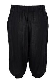 Product shot of the Out Of Office Woven Cotton Longline Shorts - Black in colour Black, from the back