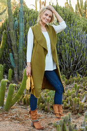 Model Marnee wearing size 8 of the Round Em Up Vest in colour Forest (Green), from the front, showing the whole outfit