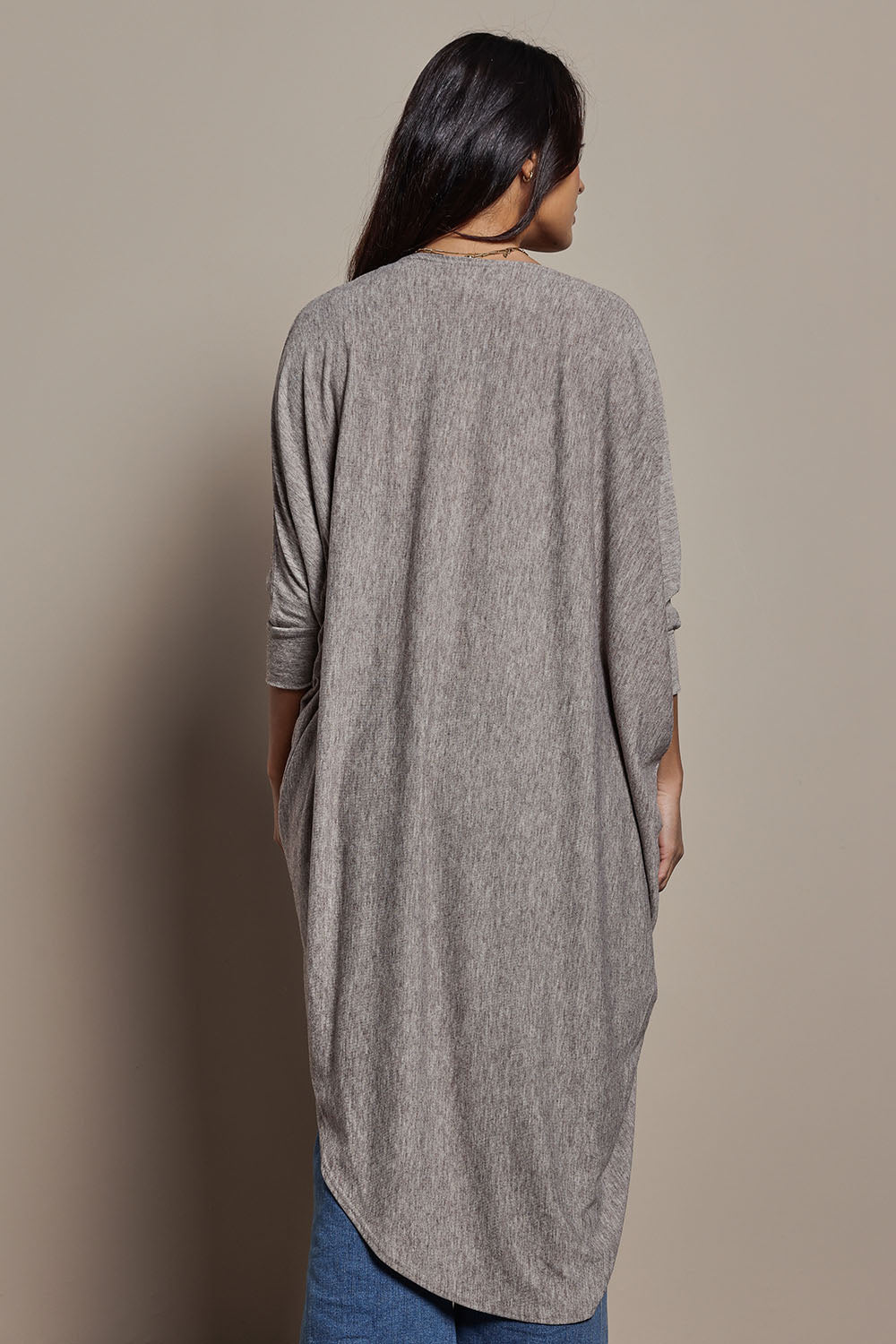 Model Tahnee wearing size 10 of the Falling For You Cardi in colour Rock, from the back