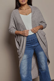 Model Tahnee wearing size 10 of the Falling For You Cardi in colour Rock, from the front, cropped image