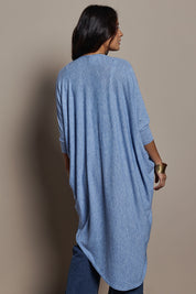 Model Tahnee wearing size 10 of the Falling For You Cardi in colour Sky (Blue), from the back