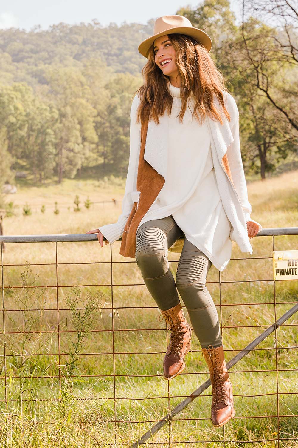 Model Ilona wearing size S of the Crossing The Plains Cotton Sweater in colour Snow (White), from the front, showing the whole outfit