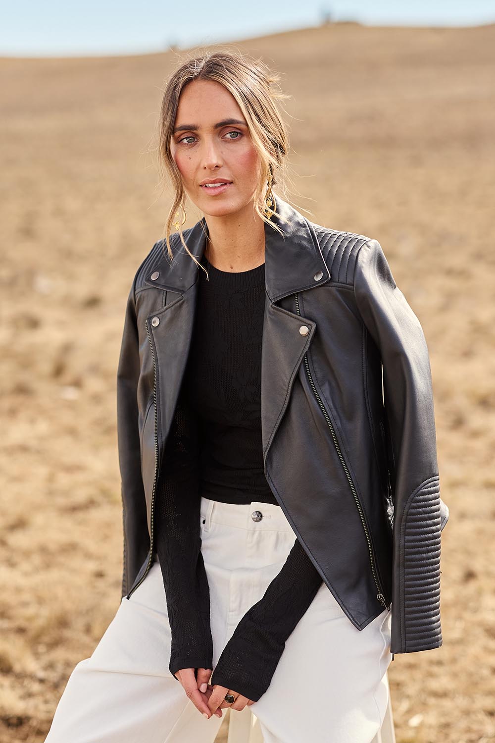 Model Tegan wearing size 10 of the Urban Nomad Leather Jacket in colour Black (Black), from the front, showing the whole outfit