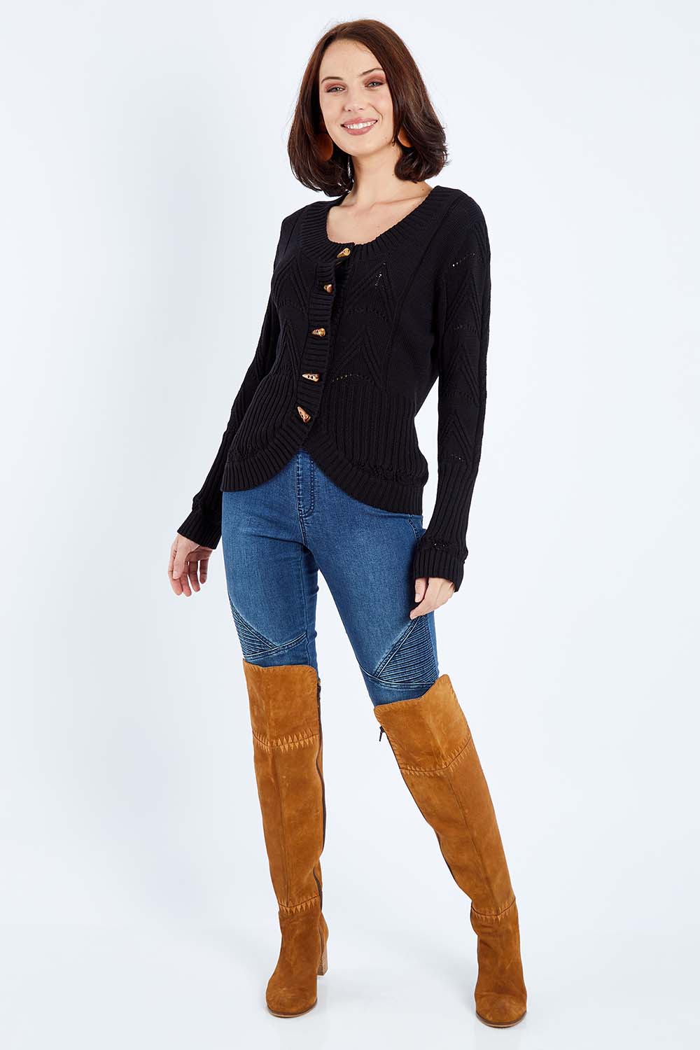 Model Andrea wearing size S of the Fireside Button Cardigan in colour Black (Black), from the front, showing the whole outfit