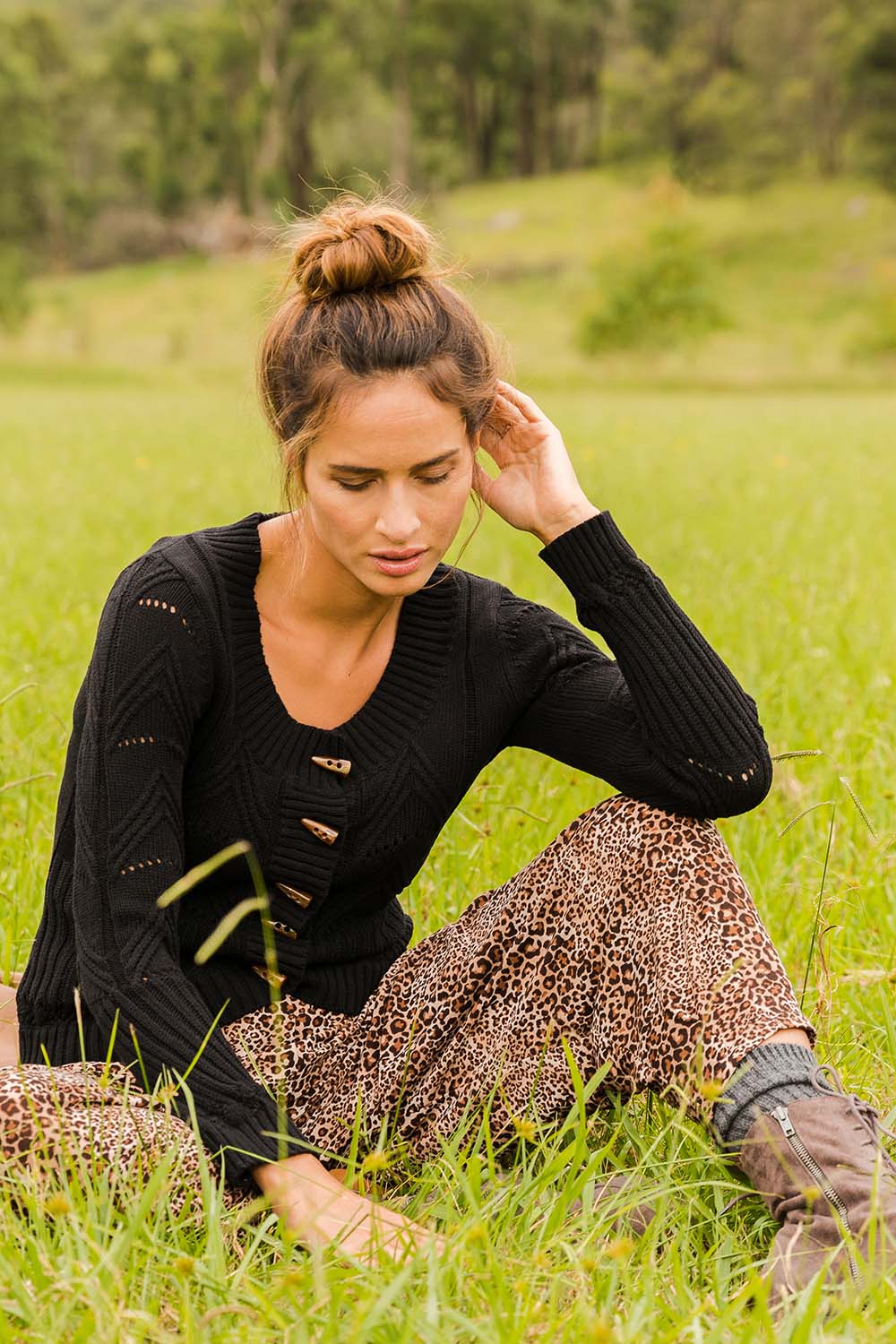 Model Ilona wearing size S of the Fireside Button Cardigan in colour Black (Black), from the front, showing the whole outfit