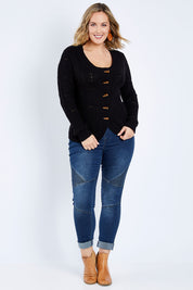 Model Jess wearing size L of the Fireside Button Cardigan in colour Black (Black), from the front, showing the whole outfit