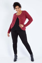 Model Sasha-Lee wearing size XL of the Fireside Button Cardigan in colour Plum (Red), from the front, showing the whole outfit