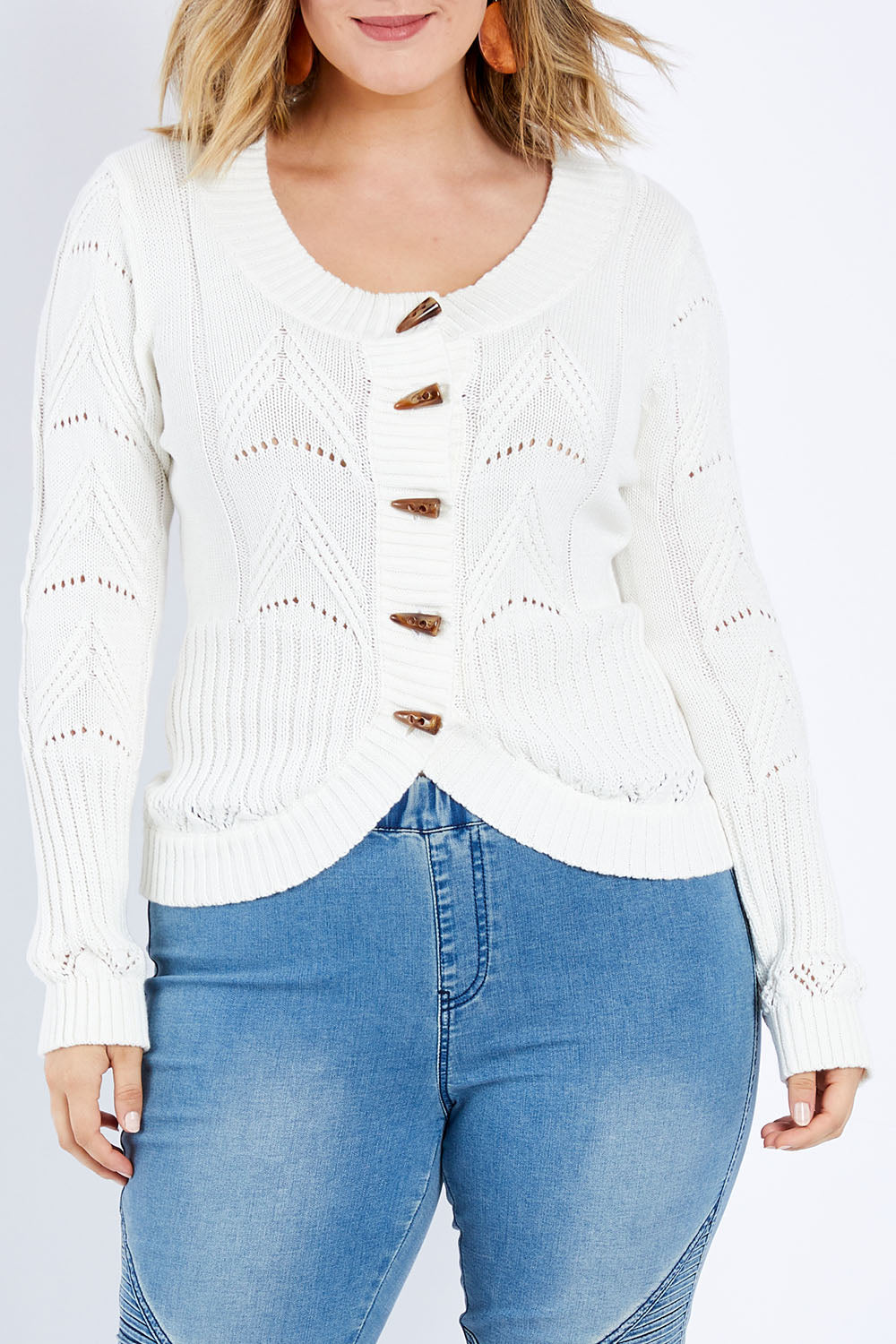 Model Jess wearing size L of the Fireside Button Cardigan in colour Snow (White), from the front, cropped image