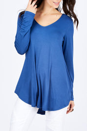 Model Georgia wearing size 10 of the Long Sleeve Softly Swinging Bamboo Tee in colour BlueJeans (Blue), from the front, cropped image