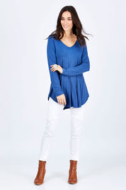 Model Georgia wearing size 10 of the Long Sleeve Softly Swinging Bamboo Tee in colour BlueJeans (Blue), from the front, showing the whole outfit