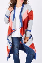 Model Mae wearing size XL of the Tribal Colours Cardigan in colour Rainbow (Grey), from the front, showing the whole outfit