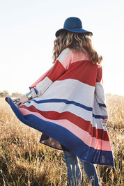 Model Marnee wearing size S of the Tribal Colours Cardigan in colour Rainbow (Grey), from the front, showing the whole outfit