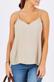 Model Georgia wearing size 10 of the Runaway Top in colour Sand, from the front, cropped image