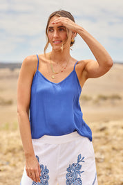 Model Tegan wearing size 10 of the Runaway Top in colour Ultramarin (Blue), from the front, showing the whole outfit
