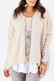 Model Georgia wearing size S of the Yeye Slouch Jumper in colour Sandy, from the front, cropped image