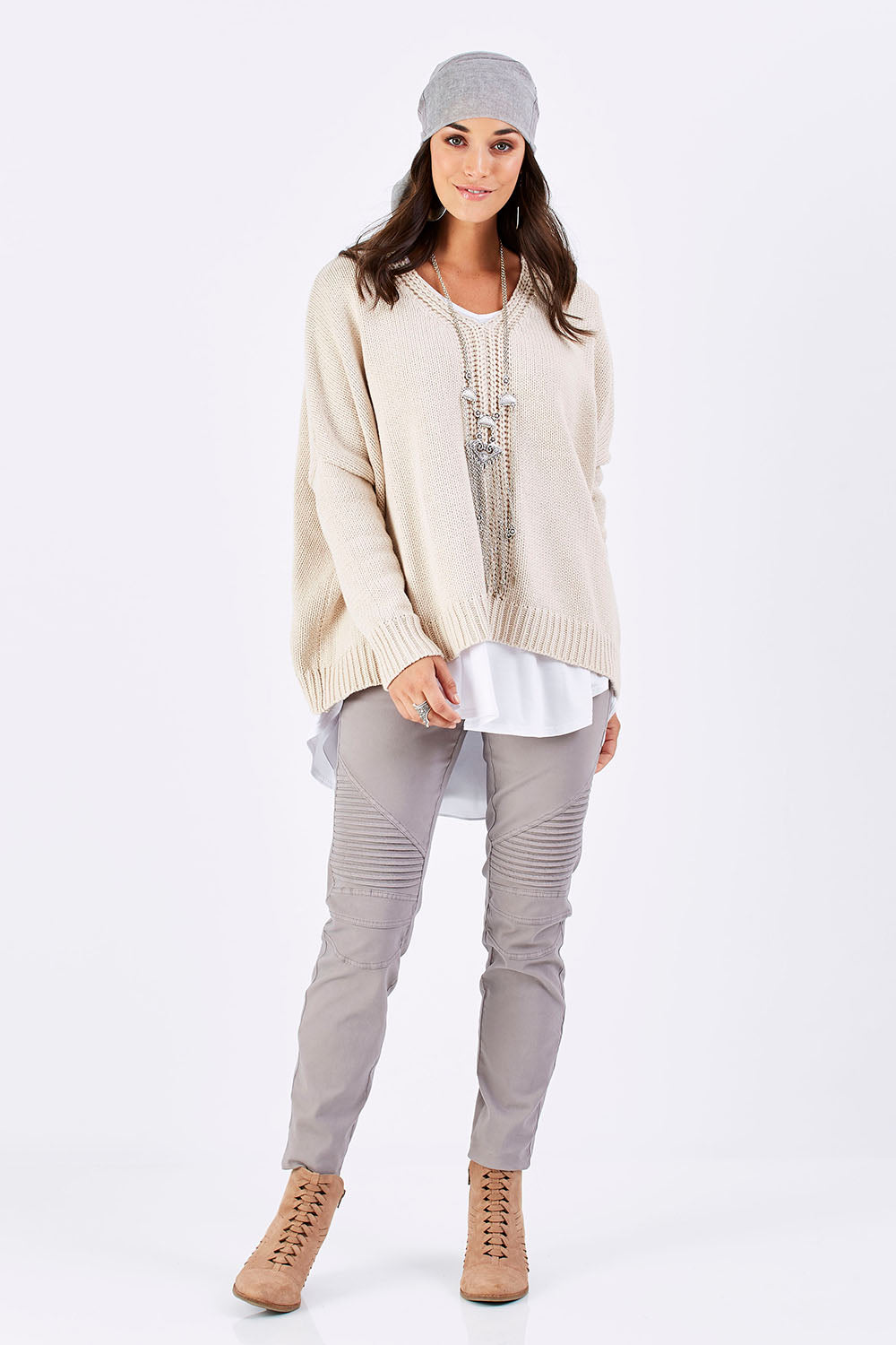Model Georgia wearing size S of the Yeye Slouch Jumper in colour Sandy, from the front, showing the whole outfit