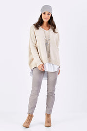 Model Georgia wearing size S of the Yeye Slouch Jumper in colour Sandy, from the front, showing the whole outfit