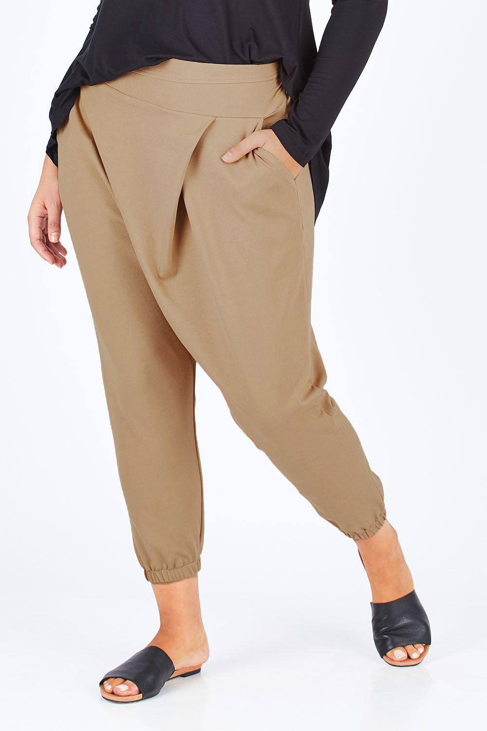 Model Natalia wearing size 14 of the Relax With Me Pants in colour Tobacco, from the front, cropped image