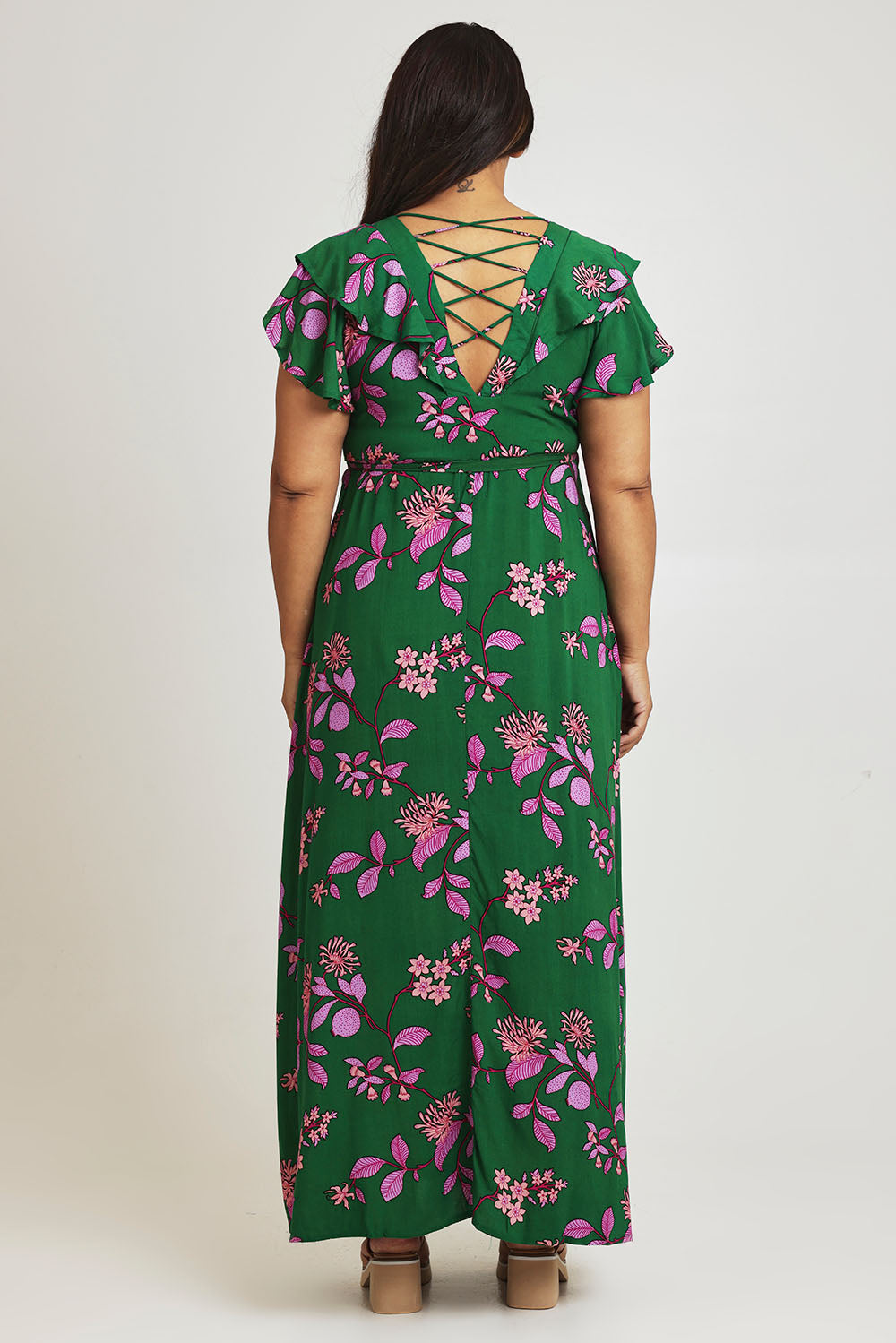 Model Ashleigh wearing size 16 of the Bellezza Maxi Dress in colour Pinkfleur (Green), from the back