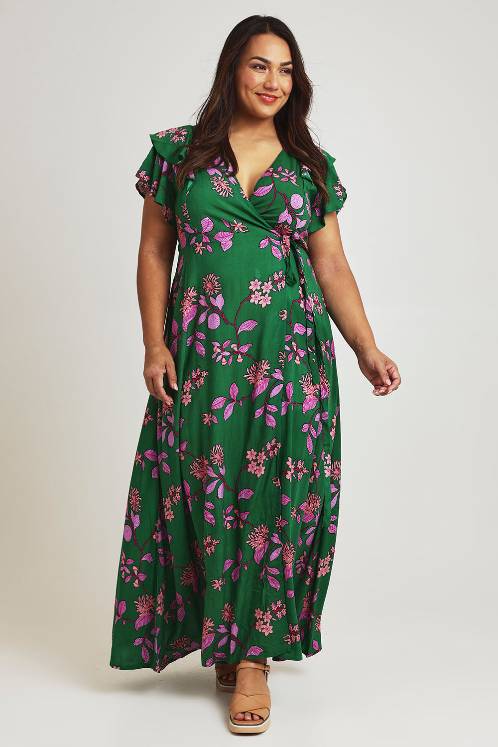 Model Ashleigh wearing size 16 of the Bellezza Maxi Dress in colour Pinkfleur (Green), from the front, showing the whole outfit
