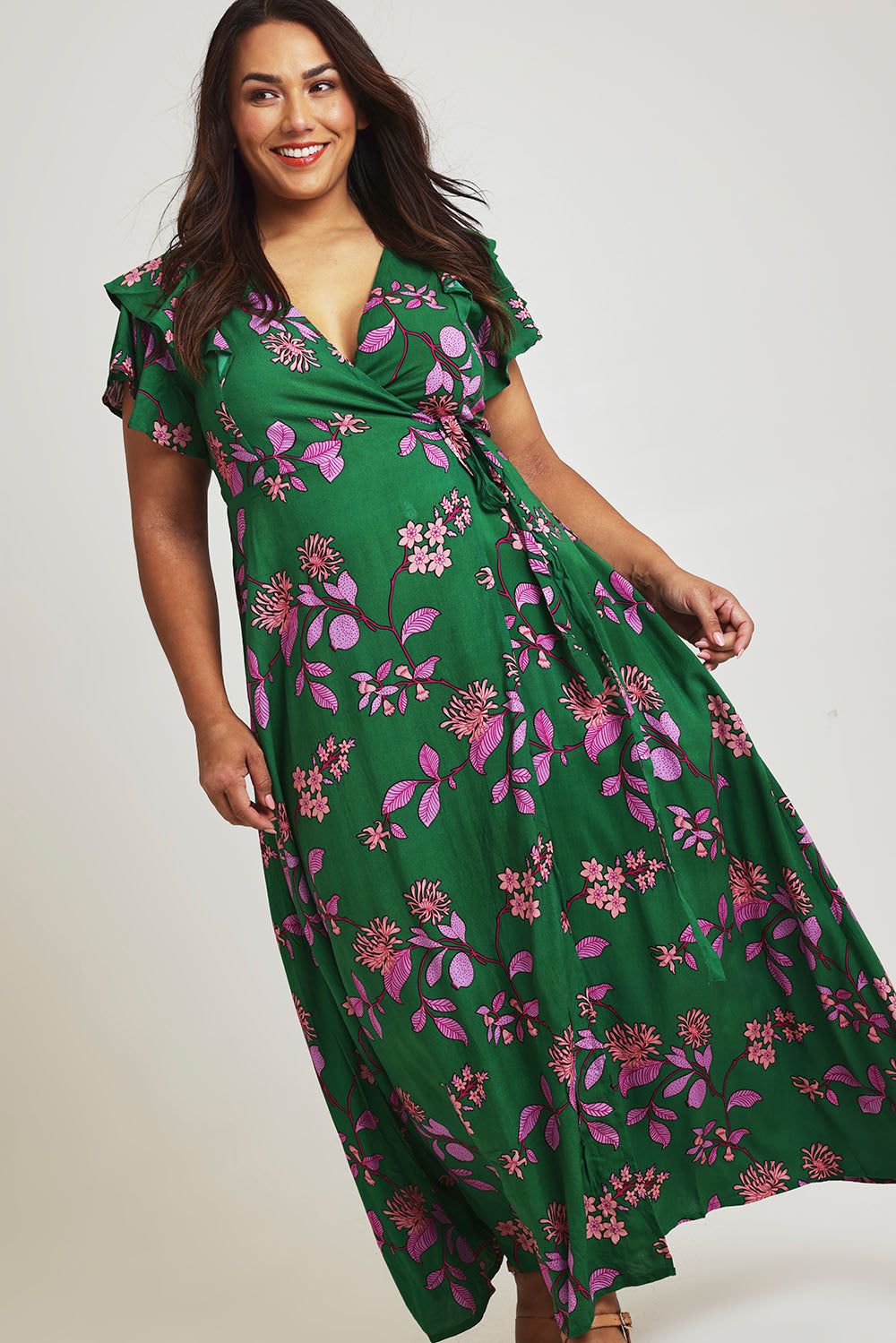 Model Ashleigh wearing size 16 of the Bellezza Maxi Dress in colour Pinkfleur (Green)