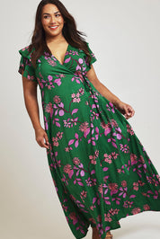 Model Ashleigh wearing size 16 of the Bellezza Maxi Dress in colour Pinkfleur (Green)
