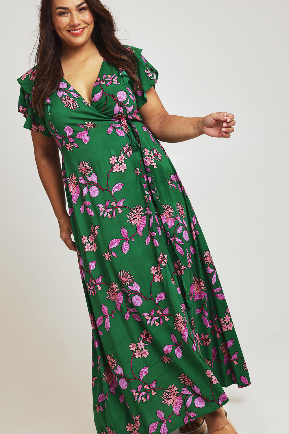 Model Ashleigh wearing size 16 of the Bellezza Maxi Dress in colour Pinkfleur (Green)