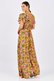 Model Georgia wearing size 10 of the Bellezza Maxi Dress in colour Sunset, from the back