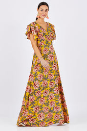 Model Georgia wearing size 10 of the Bellezza Maxi Dress in colour Sunset, from the front, showing the whole outfit
