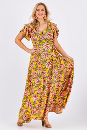 Model Jess wearing size 12 of the Bellezza Maxi Dress in colour Sunset, from the front, showing the whole outfit