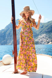 Model Marnee wearing size 10 of the Bellezza Maxi Dress in colour Sunset, from the front, showing the whole outfit